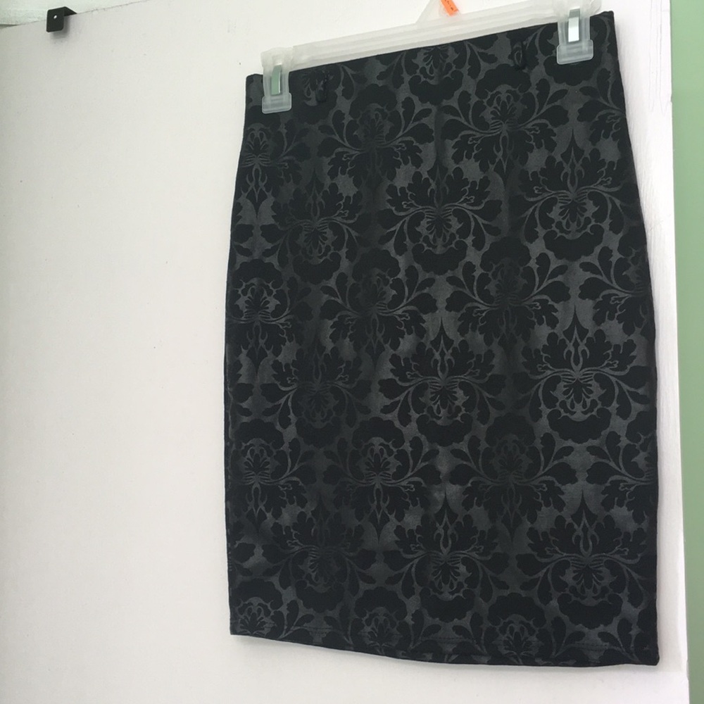 A floral print black mini skirt